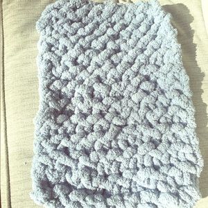 small throw blanket. (Or dog blanket)